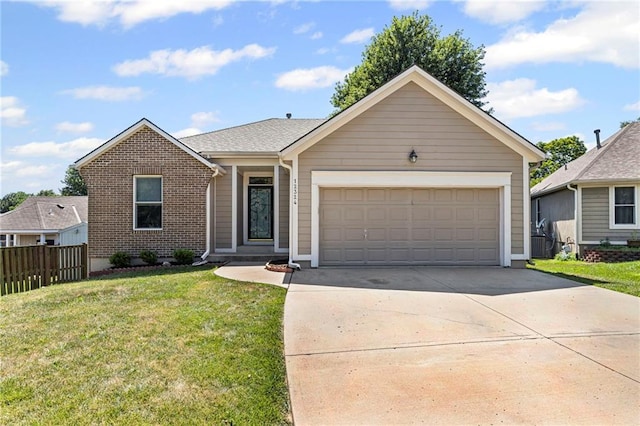 12324 S Clinton St, Olathe, KS 66061 - view of front of house with an attached garage, concrete driveway, and brick siding