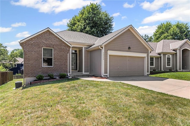 12324 S Clinton St, Olathe, KS 66061 - single story home with an attached garage, driveway, brick siding, and a shingled roof