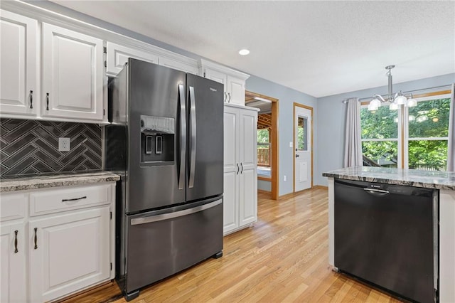 12324 S Clinton St, Olathe, KS 66061 - kitchen with stainless steel fridge, dishwasher, a chandelier, light wood finished floors, and decorative backsplash