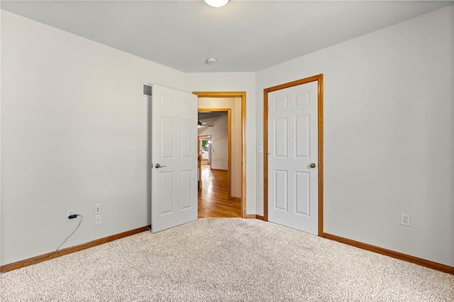 12324 S Clinton St, Olathe, KS 66061 - unfurnished bedroom featuring baseboards and carpet flooring
