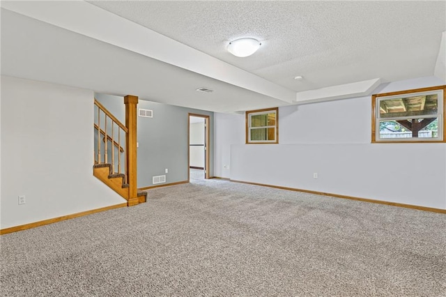 12324 S Clinton St, Olathe, KS 66061 - carpeted spare room featuring a textured ceiling and stairs