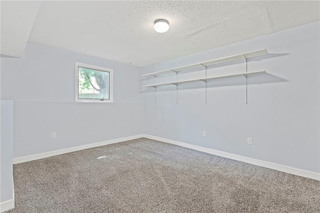 12324 S Clinton St, Olathe, KS 66061 - carpeted spare room featuring a textured ceiling and baseboards