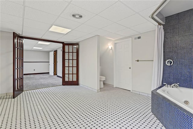 12324 S Clinton St, Olathe, KS 66061 - bathroom featuring french doors and a paneled ceiling