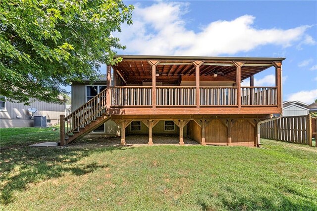 12324 S Clinton St, Olathe, KS 66061 - back of house with a yard, a wooden deck, and stairs