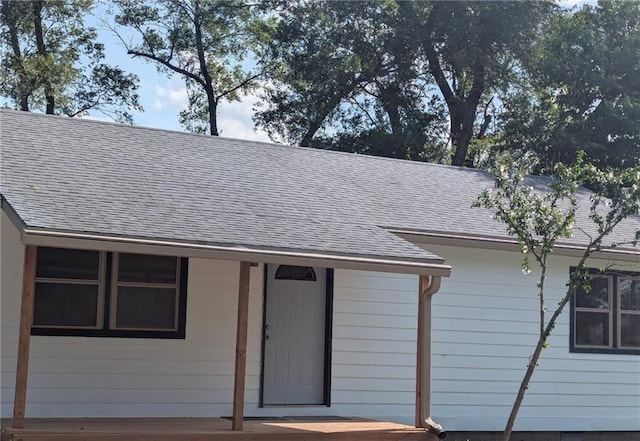 925 E 21st Ter, Lawrence, KS 66046 - exterior view of a downspout, a shingled roof, and gutters