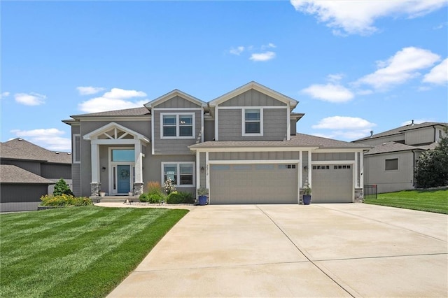 2312 SW Morris Dr, Lees Summit, MO 64082 - view of front facade with board and batten siding, a front lawn, concrete driveway, and a garage