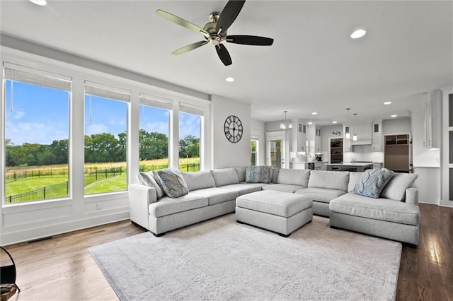 2312 SW Morris Dr, Lees Summit, MO 64082 - living room with a ceiling fan, recessed lighting, and wood finished floors