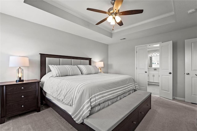 2312 SW Morris Dr, Lees Summit, MO 64082 - bedroom with light carpet, a tray ceiling, ornamental molding, a ceiling fan, and ensuite bathroom