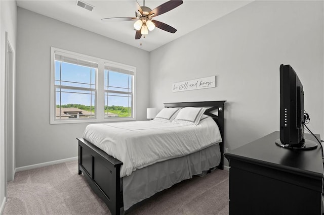 2312 SW Morris Dr, Lees Summit, MO 64082 - carpeted bedroom with baseboards and ceiling fan