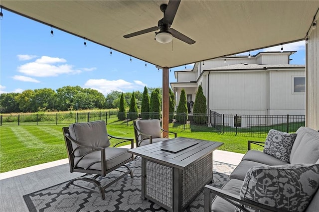 2312 SW Morris Dr, Lees Summit, MO 64082 - fenced backyard with an outdoor hangout area, a patio area, and a ceiling fan