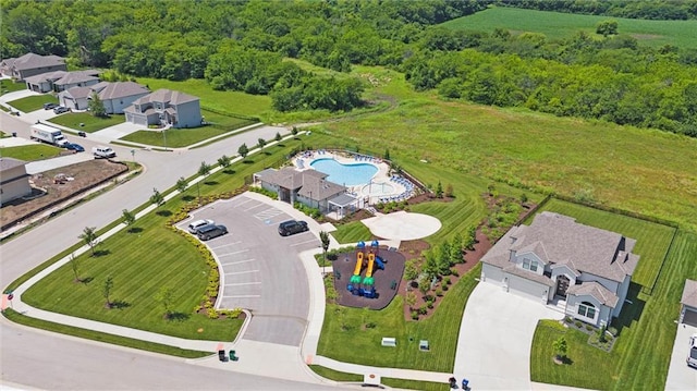 2312 SW Morris Dr, Lees Summit, MO 64082 - aerial view of a pool area and a heavily wooded area