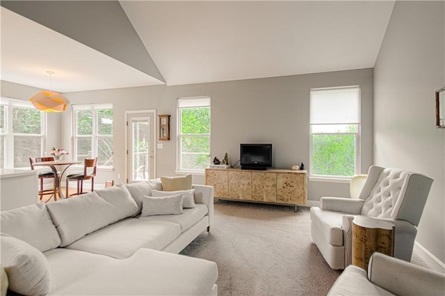 908 Pca Rd, Warrensburg, MO 64093 - carpeted living room with healthy amount of natural light and lofted ceiling