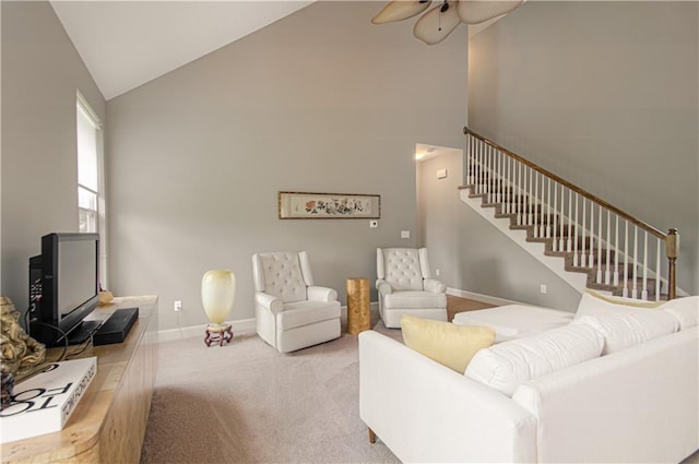 908 Pca Rd, Warrensburg, MO 64093 - living area with ceiling fan, stairway, high vaulted ceiling, and carpet floors