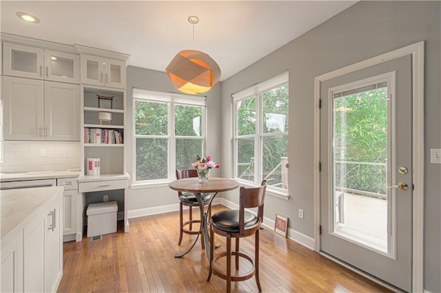 908 Pca Rd, Warrensburg, MO 64093 - dining area featuring light wood-type flooring and baseboards