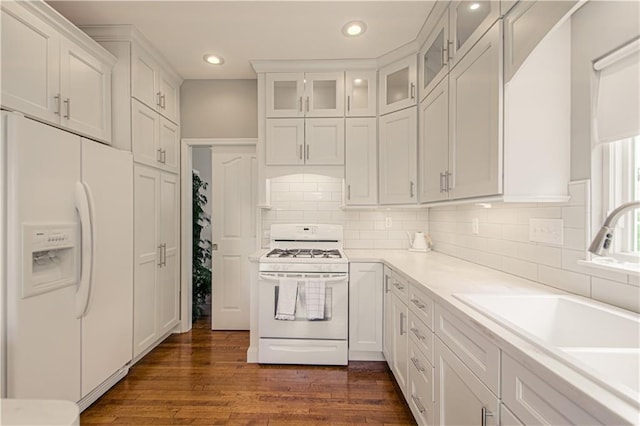 908 Pca Rd, Warrensburg, MO 64093 - kitchen with white appliances, recessed lighting, white cabinets, glass insert cabinets, and dark wood-style floors