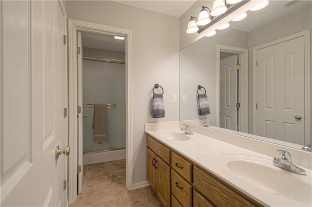 908 Pca Rd, Warrensburg, MO 64093 - full bath with double vanity, a shower stall, and tile patterned flooring