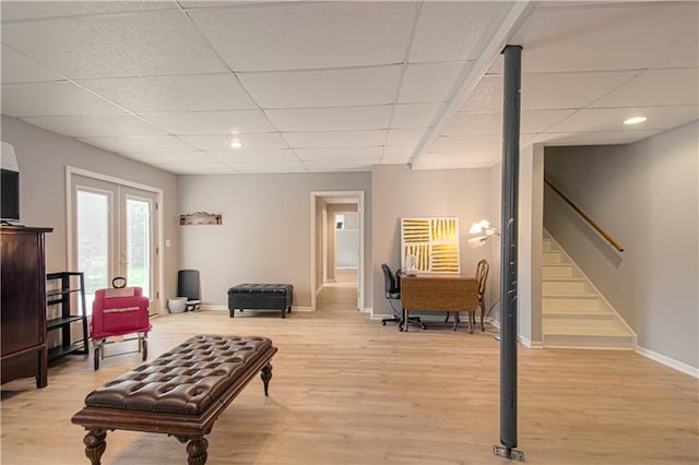 908 Pca Rd, Warrensburg, MO 64093 - living room featuring a drop ceiling, light wood-type flooring, stairs, and recessed lighting