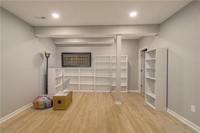 908 Pca Rd, Warrensburg, MO 64093 - unfurnished living room featuring wood finished floors and recessed lighting