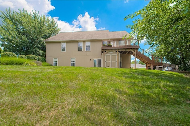 908 Pca Rd, Warrensburg, MO 64093 - back of property with a deck, a storage unit, a yard, and stairway