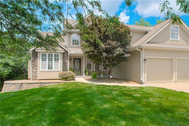 908 Pca Rd, Warrensburg, MO 64093 - view of front of home with a front lawn, a garage, concrete driveway, stone siding, and a shingled roof