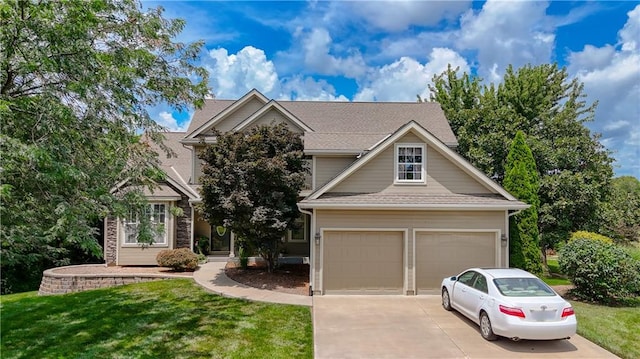 908 Pca Rd, Warrensburg, MO 64093 - view of front of house with concrete driveway, a front yard, and an attached garage