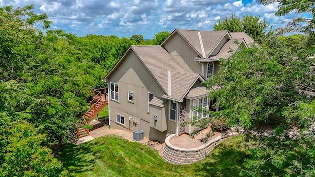 908 Pca Rd, Warrensburg, MO 64093 - view of side of home featuring stairs, roof with shingles, a lawn, and a wooden deck