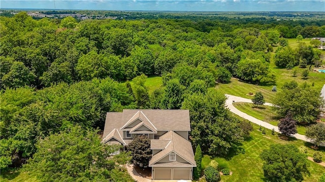 908 Pca Rd, Warrensburg, MO 64093 - aerial view of property and surrounding area with a heavily wooded area
