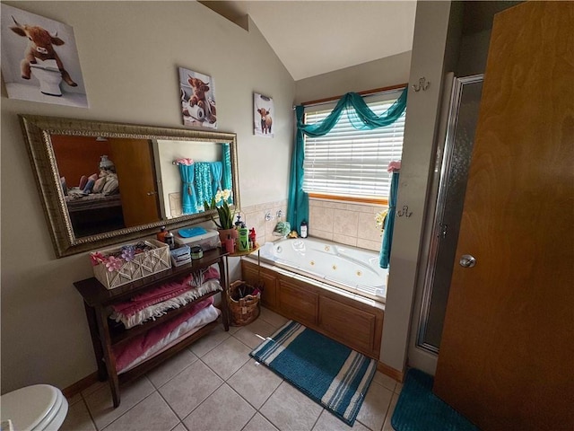 329 W 26th Ln, Eudora, KS 66025 - bathroom featuring tile patterned floors, a shower stall, lofted ceiling, and a tub with jets