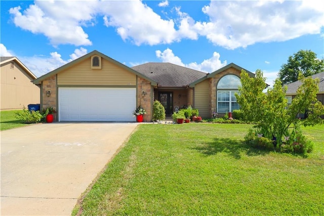 329 W 26th Ln, Eudora, KS 66025 - ranch-style home with a garage, concrete driveway, and a front yard