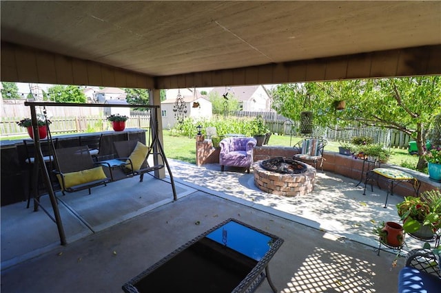 329 W 26th Ln, Eudora, KS 66025 - fenced backyard with an outdoor fire pit, a storage unit, and a patio