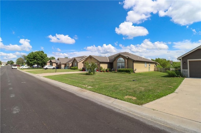 329 W 26th Ln, Eudora, KS 66025 - ranch-style house featuring a residential view, driveway, and a garage