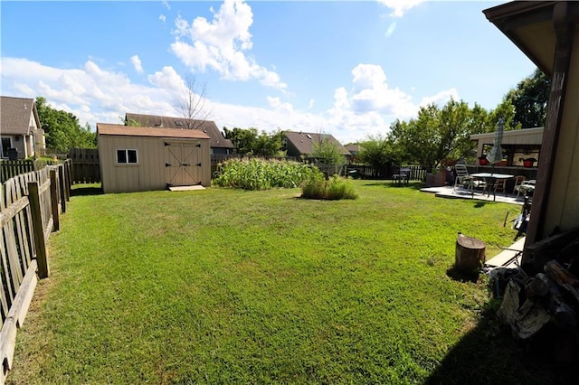 329 W 26th Ln, Eudora, KS 66025 - fenced backyard featuring a storage unit and a patio