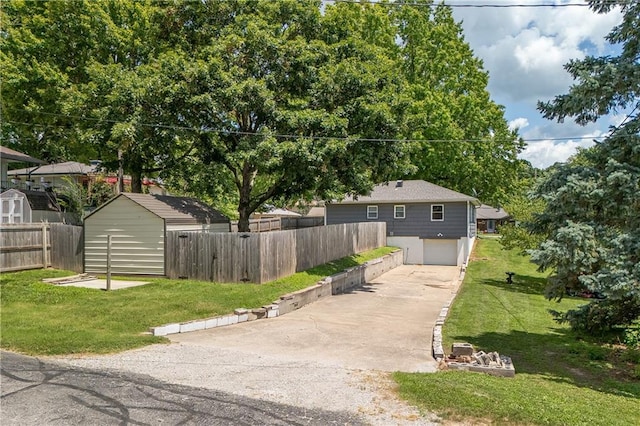 1304 S 39th St, Saint Joseph, MO 64507 - view of front facade featuring a storage unit, driveway, and an attached garage