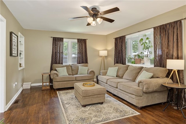 1304 S 39th St, Saint Joseph, MO 64507 - living area featuring ceiling fan and dark wood-type flooring