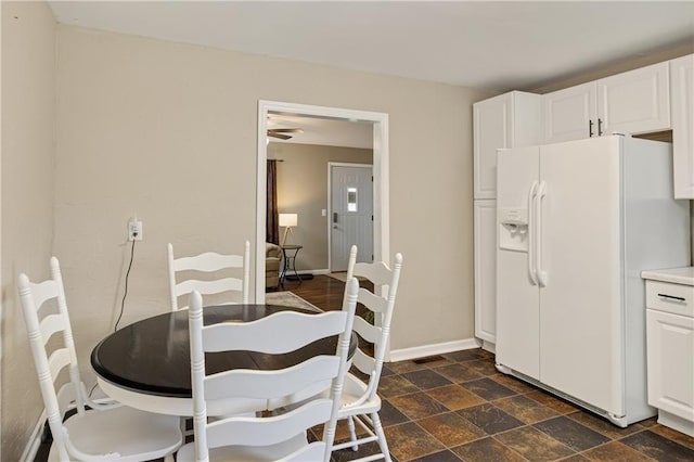 1304 S 39th St, Saint Joseph, MO 64507 - dining room with dark stone finish floors and baseboards