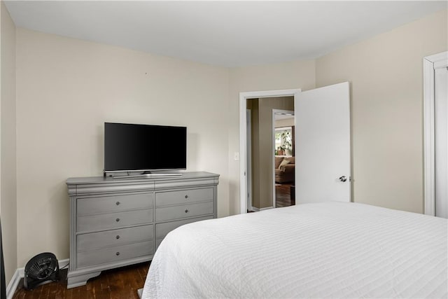 1304 S 39th St, Saint Joseph, MO 64507 - bedroom with dark wood-style floors and baseboards