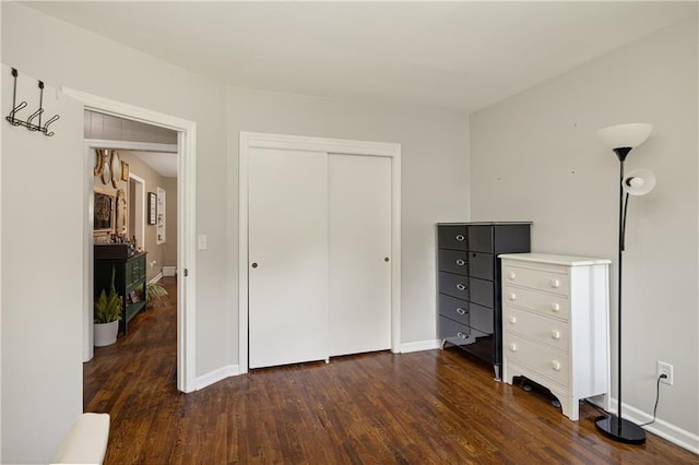 1304 S 39th St, Saint Joseph, MO 64507 - unfurnished bedroom featuring dark wood-style flooring and a closet
