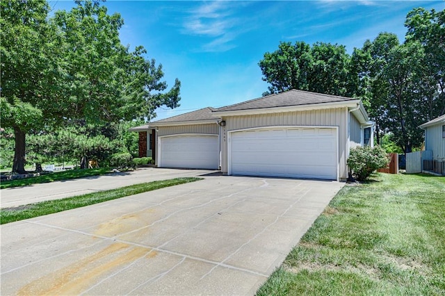 12303 W 105th Ter, Overland Park, KS 66215 - ranch-style home featuring an attached garage and driveway