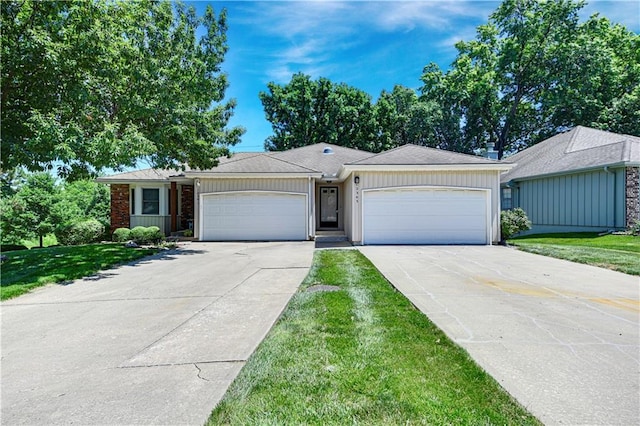 12303 W 105th Ter, Overland Park, KS 66215 - single story home featuring an attached garage, driveway, and a front yard