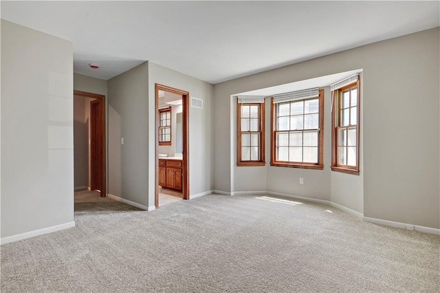 12303 W 105th Ter, Overland Park, KS 66215 - unfurnished room featuring light colored carpet and healthy amount of natural light