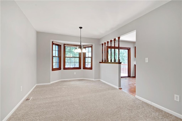 12303 W 105th Ter, Overland Park, KS 66215 - spare room with light colored carpet and a chandelier