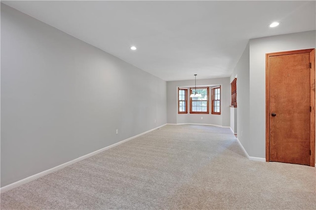12303 W 105th Ter, Overland Park, KS 66215 - empty room featuring light colored carpet, recessed lighting, and a chandelier