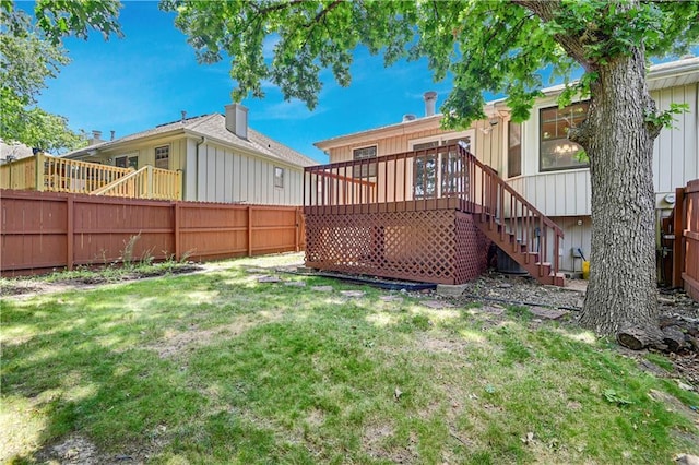 12303 W 105th Ter, Overland Park, KS 66215 - back of house with a fenced backyard, stairway, a deck, and board and batten siding