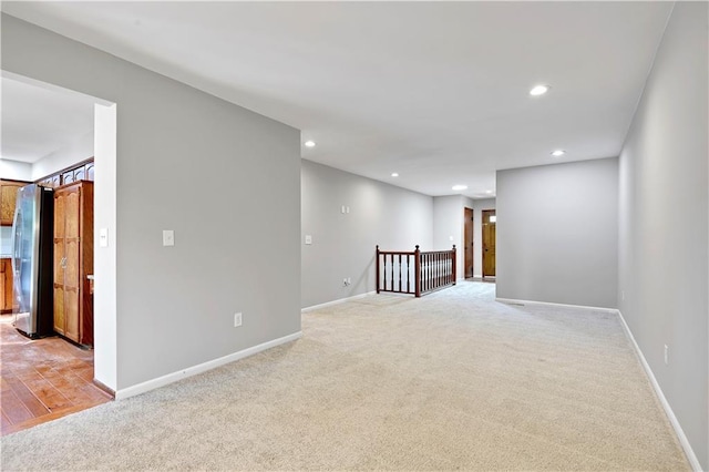 12303 W 105th Ter, Overland Park, KS 66215 - unfurnished room featuring light colored carpet and recessed lighting