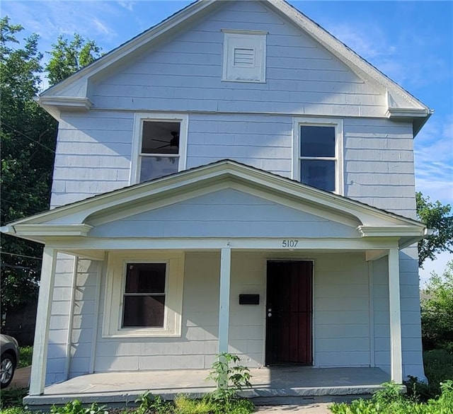 5107 E 26th St, Kansas City, MO 64127 - traditional style home featuring a porch