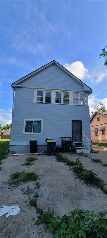 5107 E 26th St, Kansas City, MO 64127 - view of side of property featuring entry steps