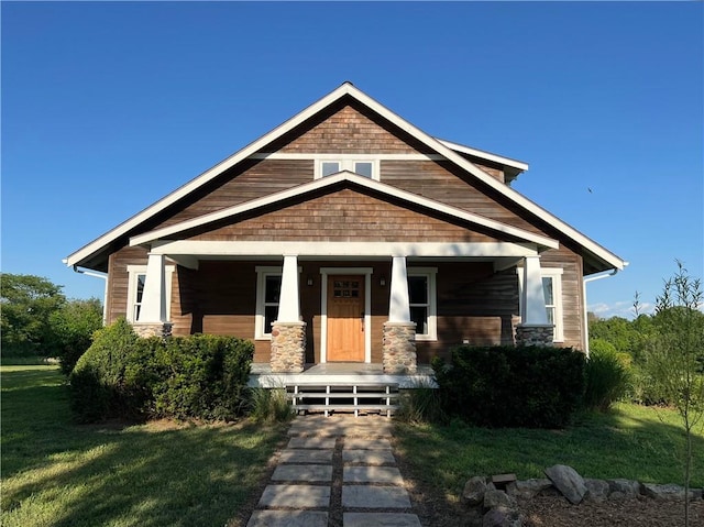 11320 Reno Rd, Oskaloosa, KS 66066 - craftsman-style home featuring a porch and a front lawn