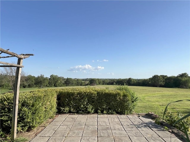 11320 Reno Rd, Oskaloosa, KS 66066 - view of patio / terrace featuring a view of rural / pastoral area