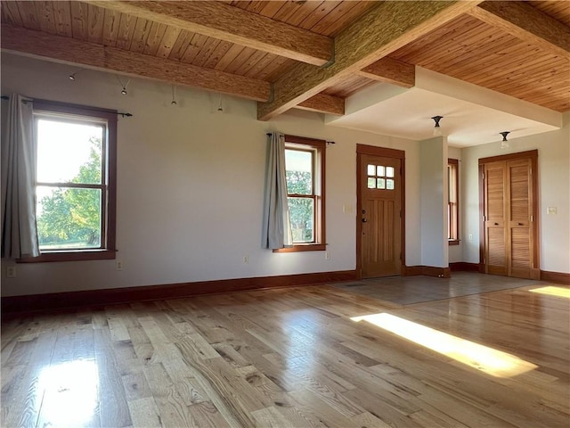 11320 Reno Rd, Oskaloosa, KS 66066 - foyer entrance featuring a wood ceiling with exposed beams, healthy amount of natural light, and hardwood / wood-style floors