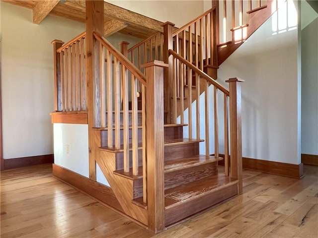 11320 Reno Rd, Oskaloosa, KS 66066 - stairs featuring wood finished floors and beamed ceiling